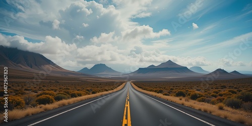 Scenic Desert Highway with Distant Mountains Under Blue Sky