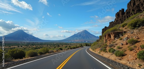 Curved Road through Rugged Landscape with Rocky Cliffs