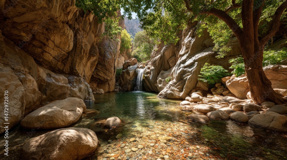Fototapeta premium A serene image of a tranquil waterfall flowing in Ayhaft Canyon's lush forest setting.