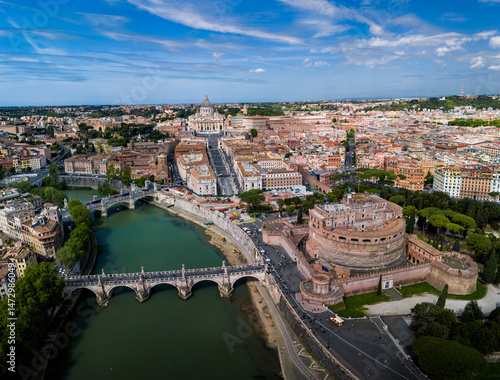 Aerial drone view of iconic Sant'Angelo Castle and Sant'Angelo bridge with Vatican City and statues in river of Tiber, Rome, Italy