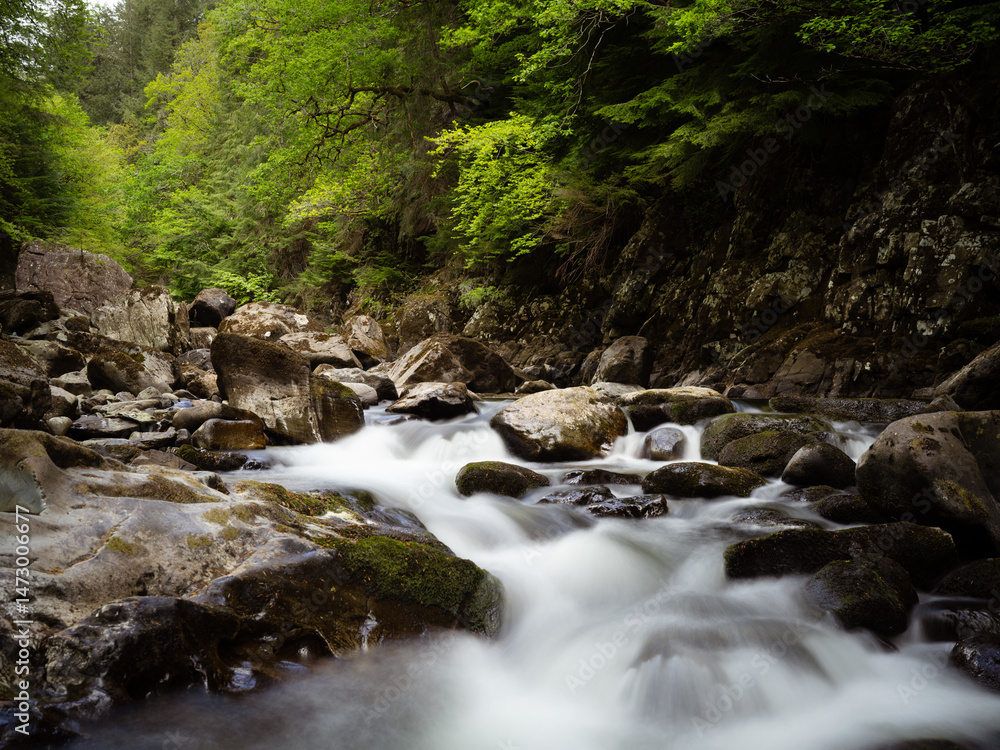 Obraz premium Betws-y-Coed, Wales, United Kingdom, 5th May2025, waterfalls at Miners Bridge on the River Llugwy