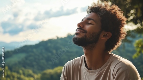 Young african american man enjoying serene nature outdoors with eyes closed