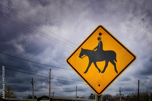 A horse rider traffic warning sign on the side of the road