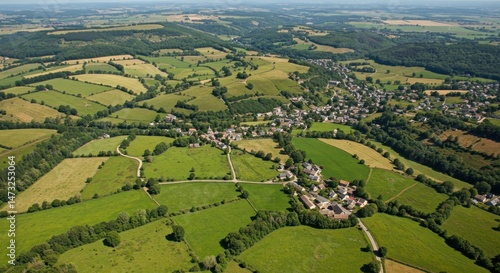 Aerial View of Countryside with Village and Green Fields