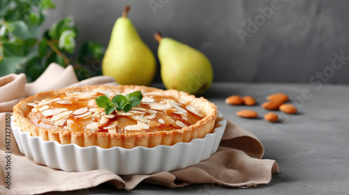 Wallpaper Mural A delectable pear tart, glazed with caramel and topped with sliced almonds, sits in a white tart pan.  Two fresh pears rest in the background Torontodigital.ca