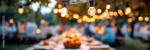 A cozy outdoor dining setting illuminated by string lights, perfect for gatherings and celebrations with friends and family.