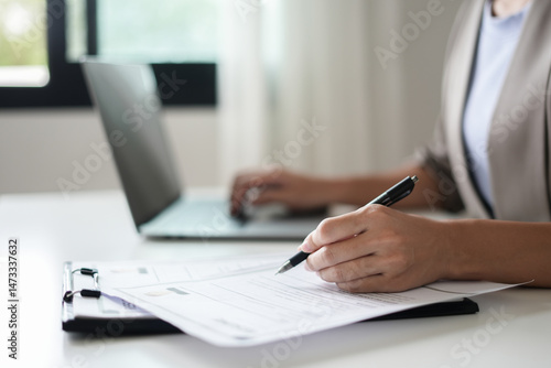 Business woman employer holding resume hiring recruit looking cv resume to hire candidates, analyzing information before job interview. Recruitment concepts