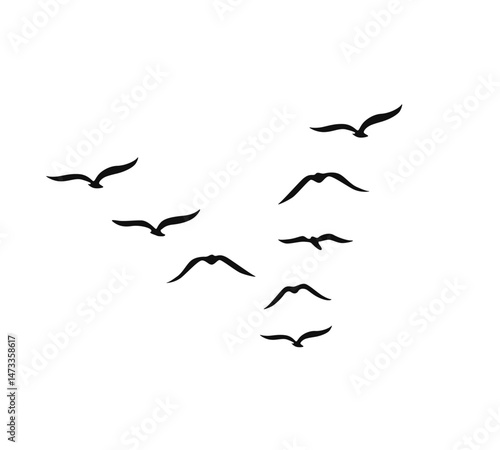 A flock of swallows silhouetted against the sky in graceful flight. Wild Birds Unlimited: your source for bird food, feeders, and expert feeding advice.