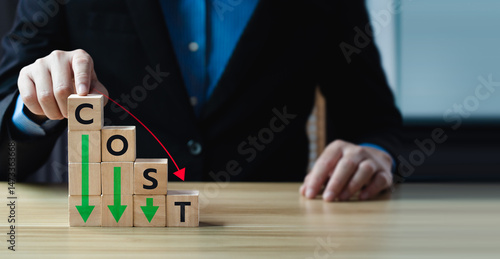 Εκτύπωση καμβά Business concept of cost reduction with stacked wooden blocks forming the word C
