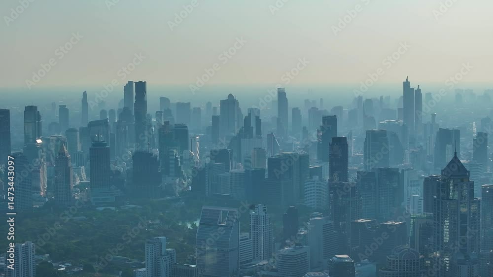 Urban skyline obscured by thick air pollution during the hazy afternoon in downtown city Urban skyline obscured by thick air pollution during the hazy afternoon in downtown city