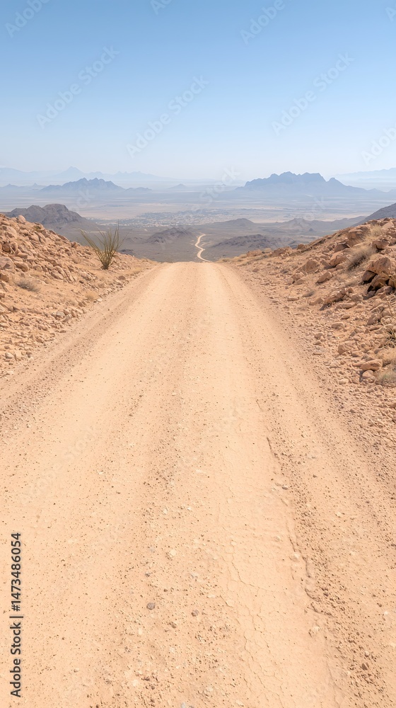Sandy Dirt Road Leading Through a Vast Desert Landscape Under Bright Sunlight Sandy Dirt Road Leading Through a Vast Desert Landscape Under Bright Sunlight