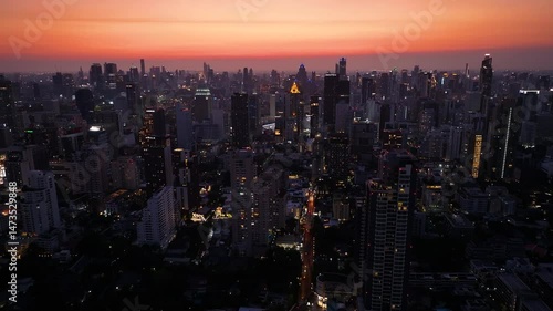 Wallpaper Mural City skyline illuminated at dusk with vibrant hues reflecting on a bustling metropolis Torontodigital.ca