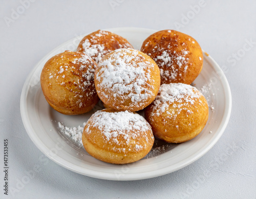 Wallpaper Mural Kuwaiti traditional flour-based khanfaroosh fritters dusted with powdered sugar served on a small plate. Torontodigital.ca