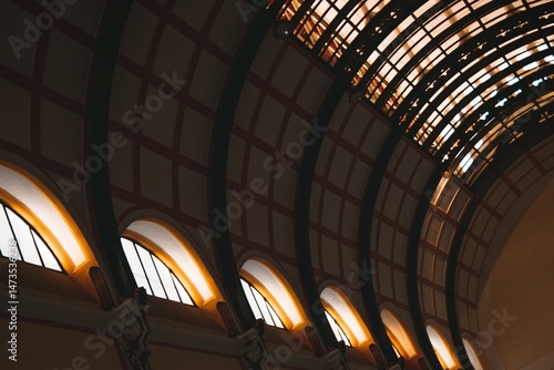 Architectural Grandeur Vaulted Ceiling with Windows in a Classic Building Interior.