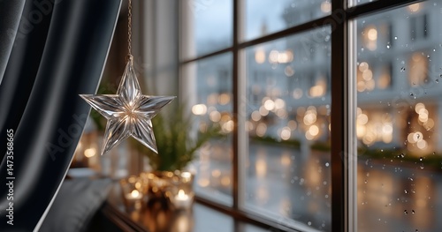 Decorative Star Ornament Shines Against a Rainy Window With Soft Lights in th...