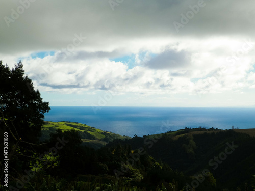Obraz na płótnie Typical landscape of Azores. Natural green fields hills and sea. w salonie