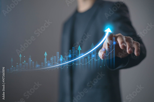 Fund investment concept, interest rate and dividend, Businessman showing a growing virtual hologram stock, Return on index fund and mutual funds, long term investment, dividend retirement fund.
