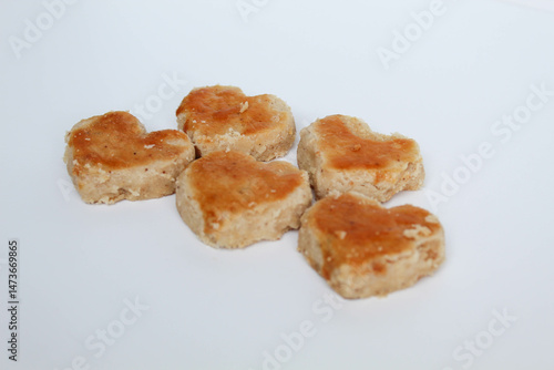 Peanut cookies in love shape, isolated on white background