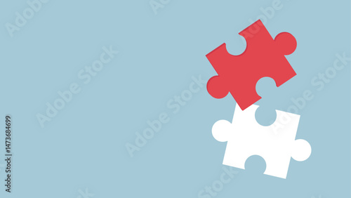 A red puzzle piece perfectly fits into the white puzzle piece space on a blue background
