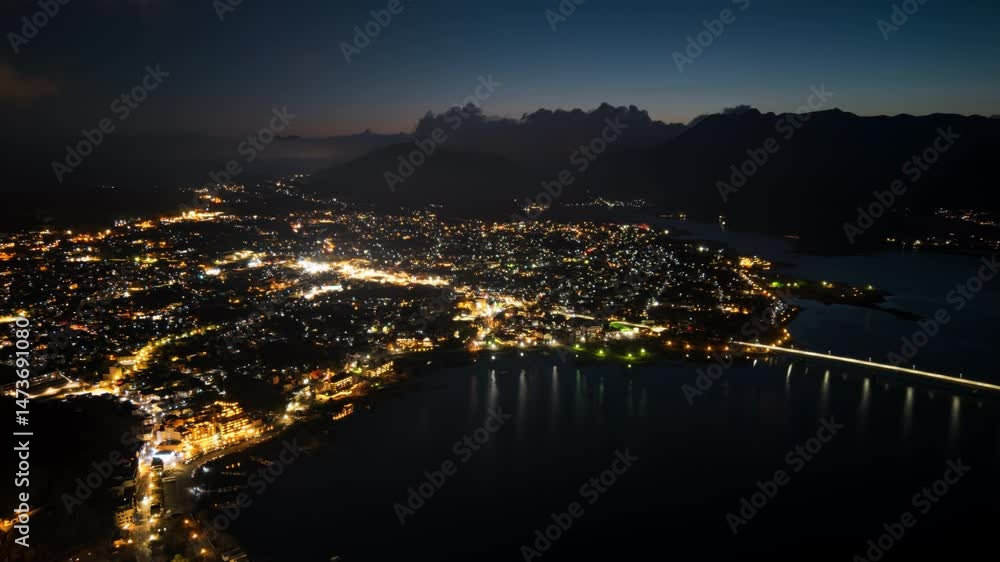 Aerial drone view of Lake Kawaguchiko near the Fujikawaguchiko town, Japan in the evening time lapse Aerial drone view of Lake Kawaguchiko near the Fujikawaguchiko town, Japan in the evening time lapse