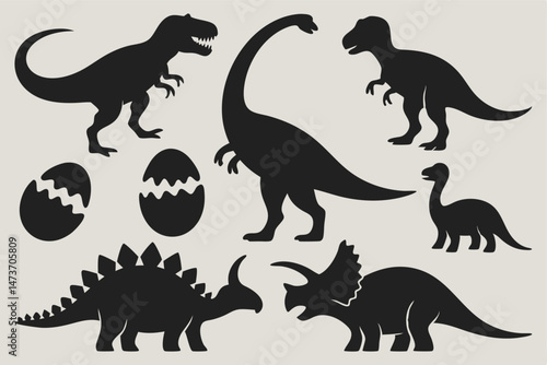 Collection of solid black dinosaur shapes including baby adult forms and eggs on a clean light background