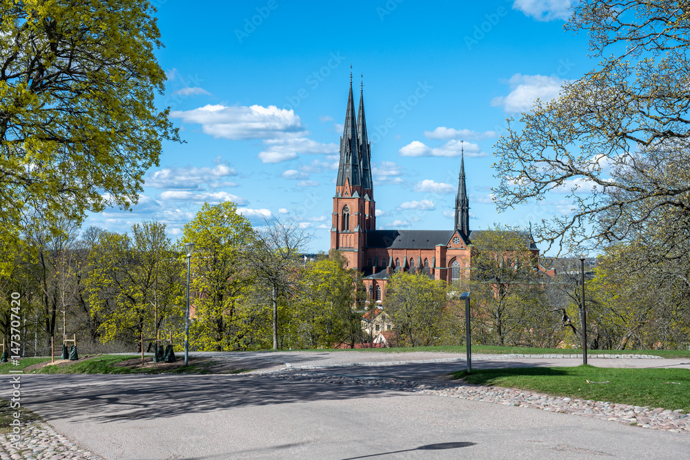 Obraz premium Uppsala Cathedral, the seat of the Archbishop of Sweden, on a sunny spring day in late April 2025. The cathedral was consecrated in 1435. 