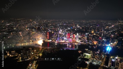 Wallpaper Mural Nighttime view of Ho Chi Minh City’s skyline with fireworks, featuring the Bitexco Tower Torontodigital.ca