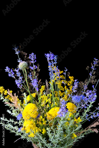 Obraz na płótnie bouquet of fresh wildflowers on black background w salonie