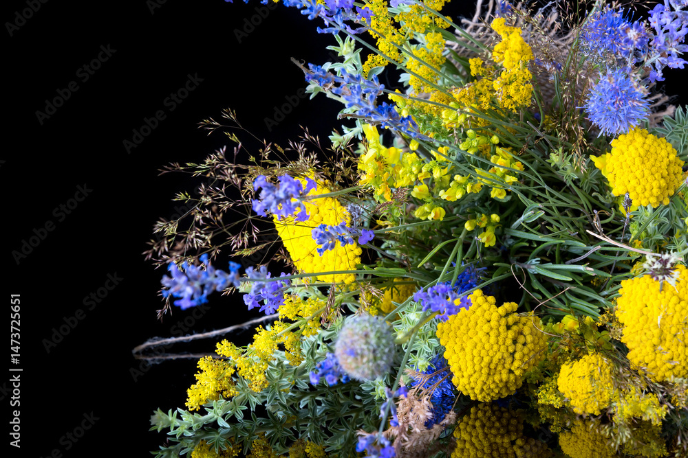 bouquet of fresh wildflowers on black background