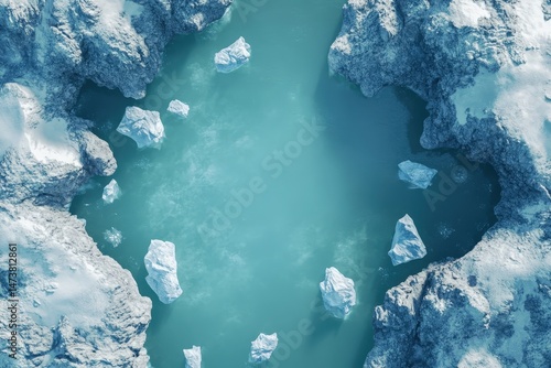A high-angle view of icy bodies of water nestled between snow-covered mountains.
