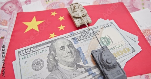 Trade war, reciprocal tariffs, economic deal and military symbolism : U.S. dollars, tanks on a Chinese flag, representing geopolitical tensions, the strategic influence of military and economic power.