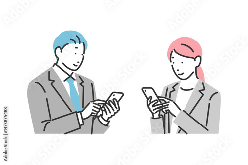 スマホを操作しているビジネスマンとビジネスウーマン