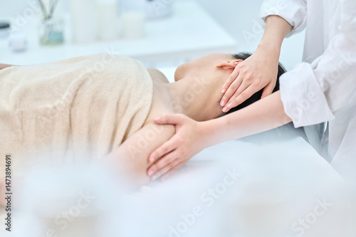 Female Neck and Shoulder Massage Therapy for Relaxation at Spa