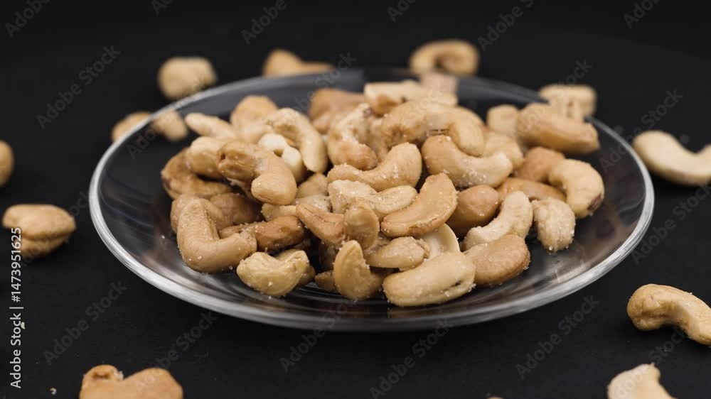 roasted salted cashew nuts on the plate. roasted salted cashew nuts on the plate.