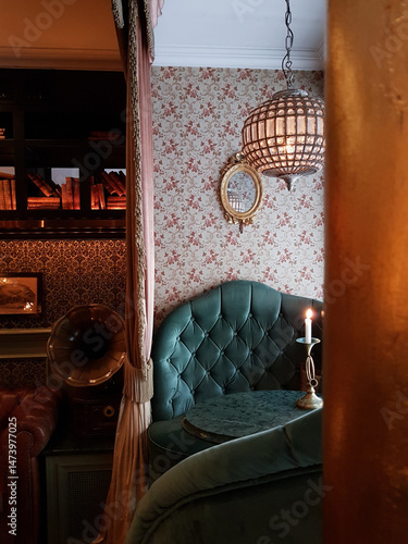Cozy Victorian Parlour with Red Floral Walls, Blue Chairs, and a Gramophone