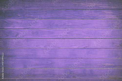 Purple painted wooden boards forming a textured background