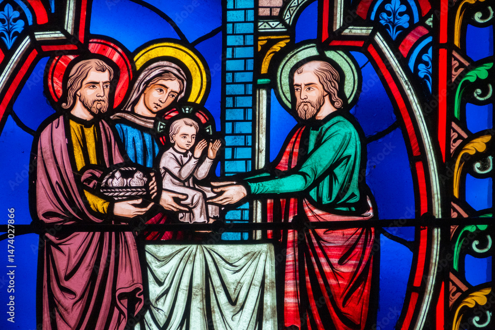 Fototapeta premium Stained glass (19th century) of Childhood of Jesus: Presentation of Jesus in the temple by Mary and Joseph.