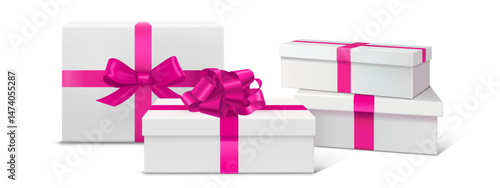 Gift box podium set with bright pink satin ribbon bows. Stacked white square pedestals. Magenta decorative ties on festive giftbox. Luxury present display platform for product showcase or celebration.