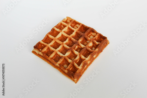 One plain square waffle cake, burnt side, isolated on white background
