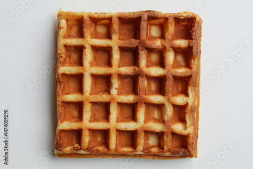 Close up texture of plain waffle, burnt side, square patterned, flat lay or top view