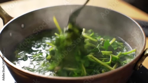 Fresh Spinach Plunging Into Boiling Water In Slow Motion Close Up