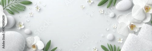 The setting includes a spa orchid, soft towels, and massage stones