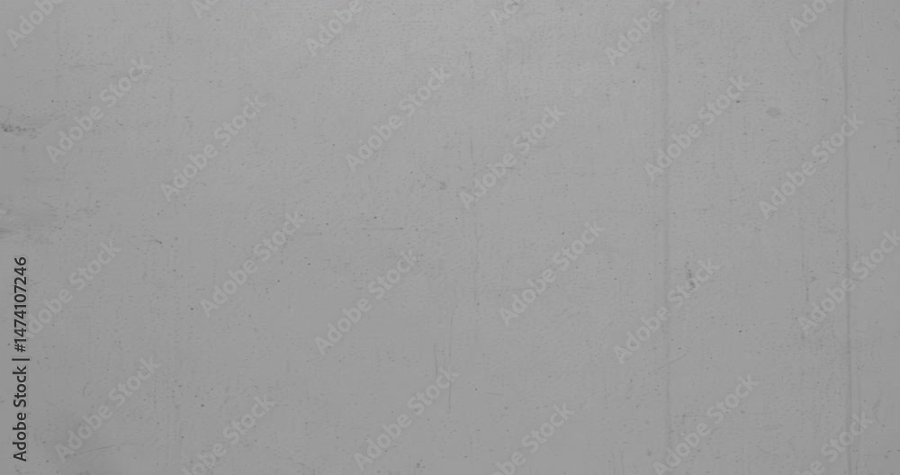 Grey Film grain seamless loop texture. Retro template backdrop for text. Old fashion tape looped animation in 4K. Vintage film effects