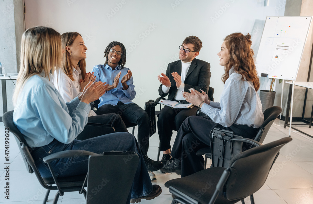Fototapeta premium Applauding together. People are in group psychological support room