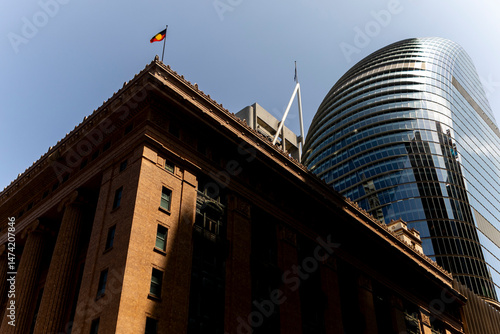 Contrasting architectural styles under a clear sky at Sidney photo