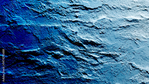 A close up of a grainy blue concrete studio wall . Blue textured plaster background with vignette effect for design projects Grungy abstract backdrop with ample copy space image
