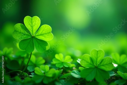 Artistic abstract background of vibrant green clover after rain, season, texture
