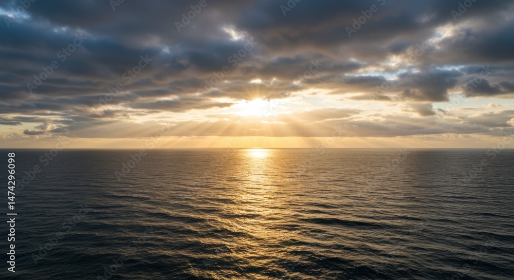 Fototapeta premium Sun Rays Over Ocean at Sunset Creating Peaceful Atmosphere