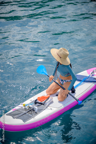 Woman tourist  paddle board at the sea summer, vacation long weekend traveling in island