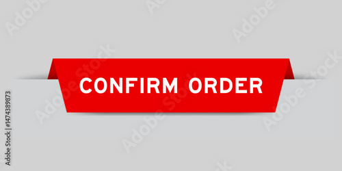 Red color inserted label with word confirm order on gray background